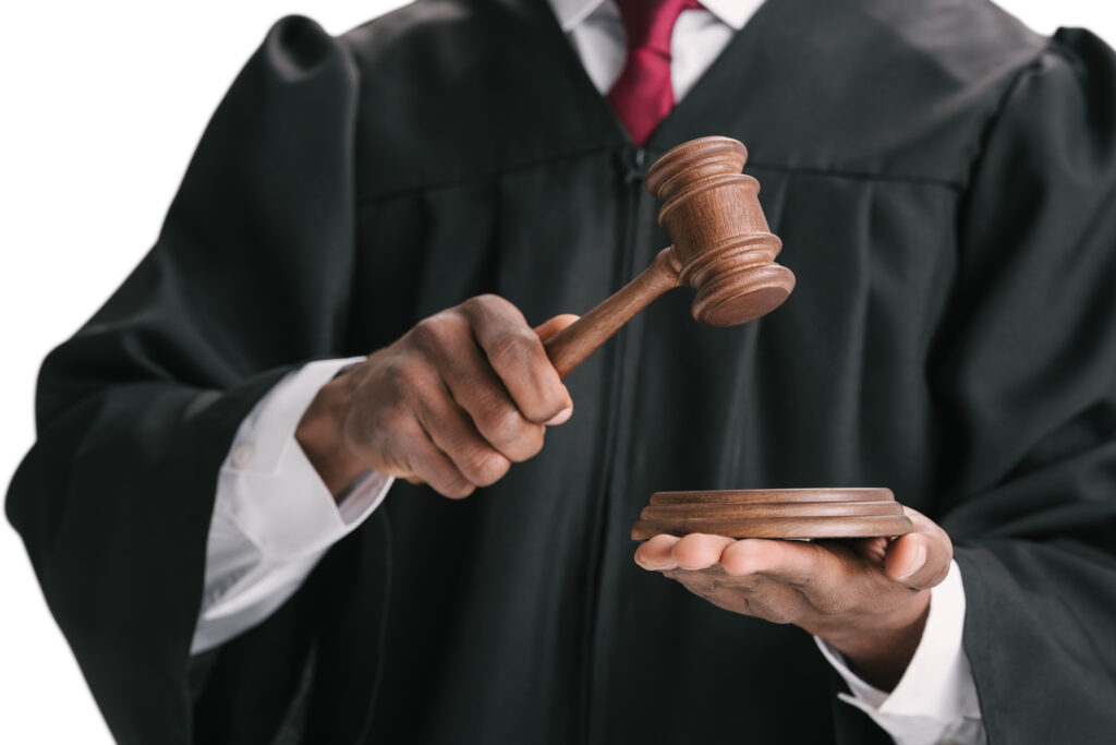 cropped shot of african-american judge with gavel isolated on white